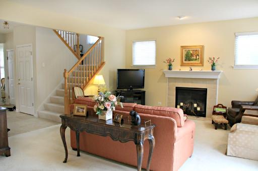 1871 Wagner Road Batavia, IL 60510 - Photo 2 of 16 a living room with furniture a flat screen tv and a fireplace