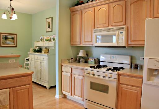 1871 Wagner Road Batavia, IL 60510 - Photo 6 of 16 a kitchen with stainless steel appliances granite countertop a stove and a refrigerator