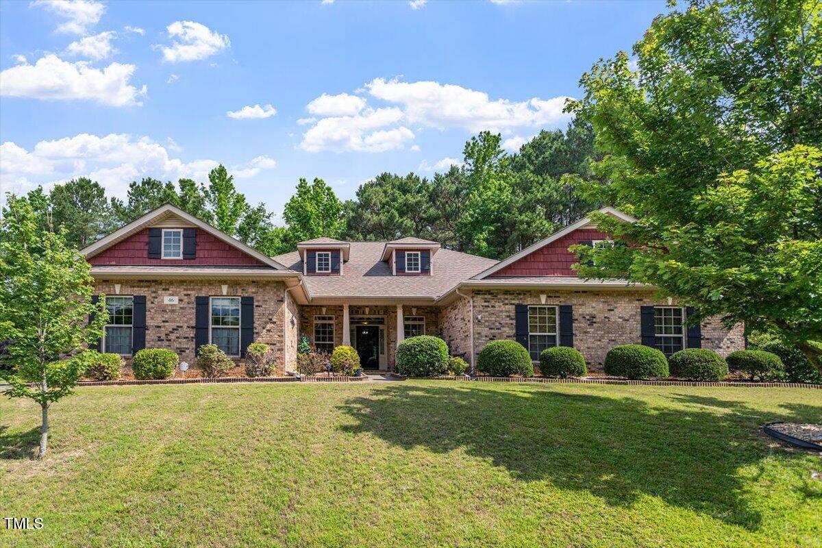 46 Spring Haven Lane Willow Spring, NC 27592 - Photo 1 of 50 a front view of a house with garden