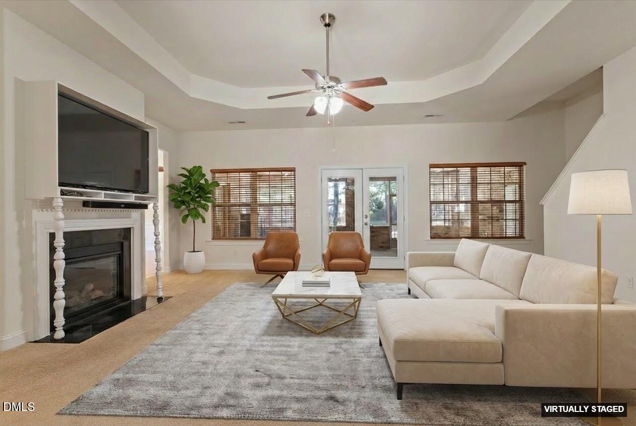 46 Spring Haven Lane Willow Spring, NC 27592 - Photo 11 of 50 a living room with furniture a fireplace and a flat screen tv