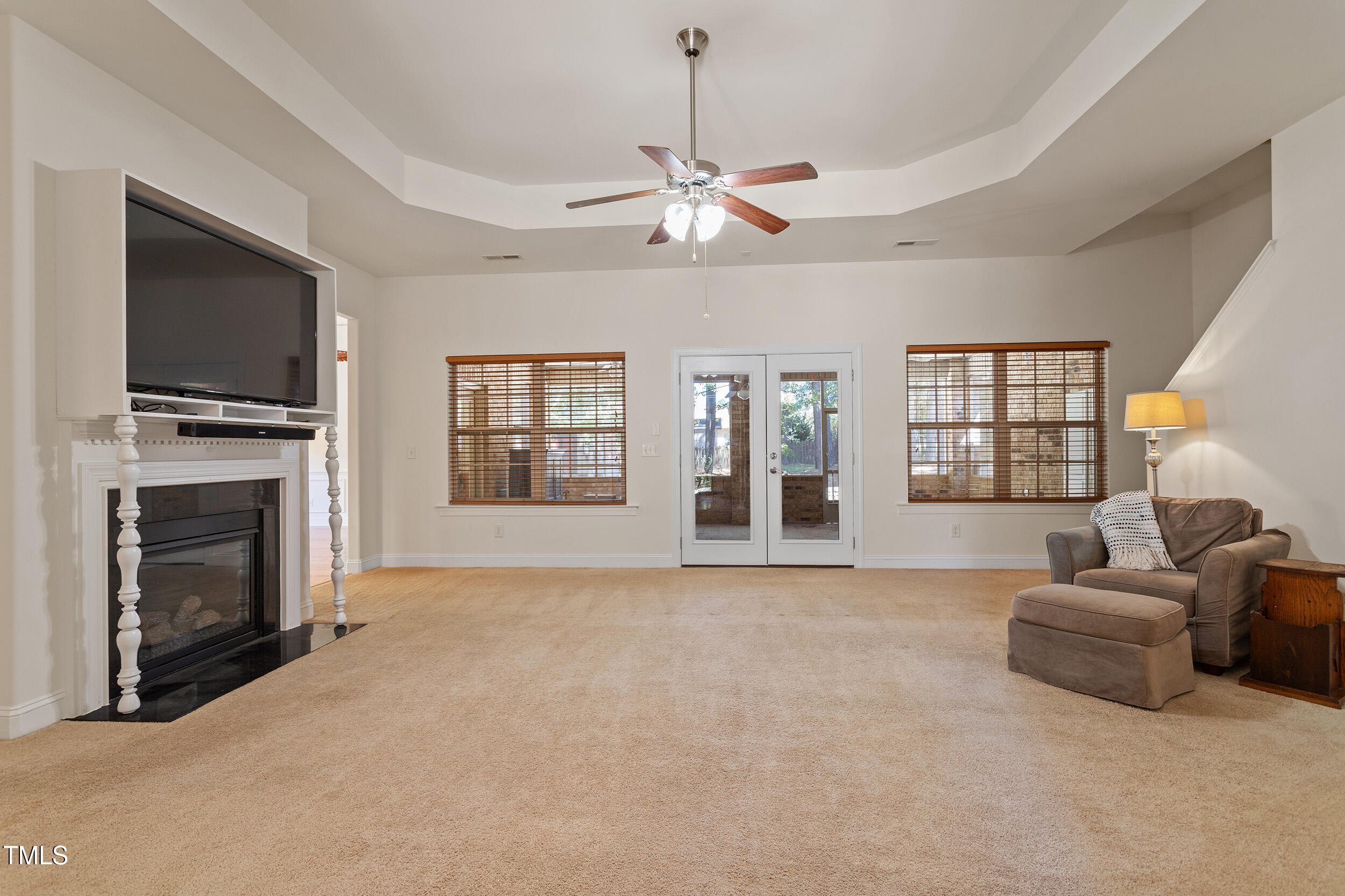 46 Spring Haven Lane Willow Spring, NC 27592 - Photo 12 of 50 a living room with furniture a fireplace and a flat screen tv