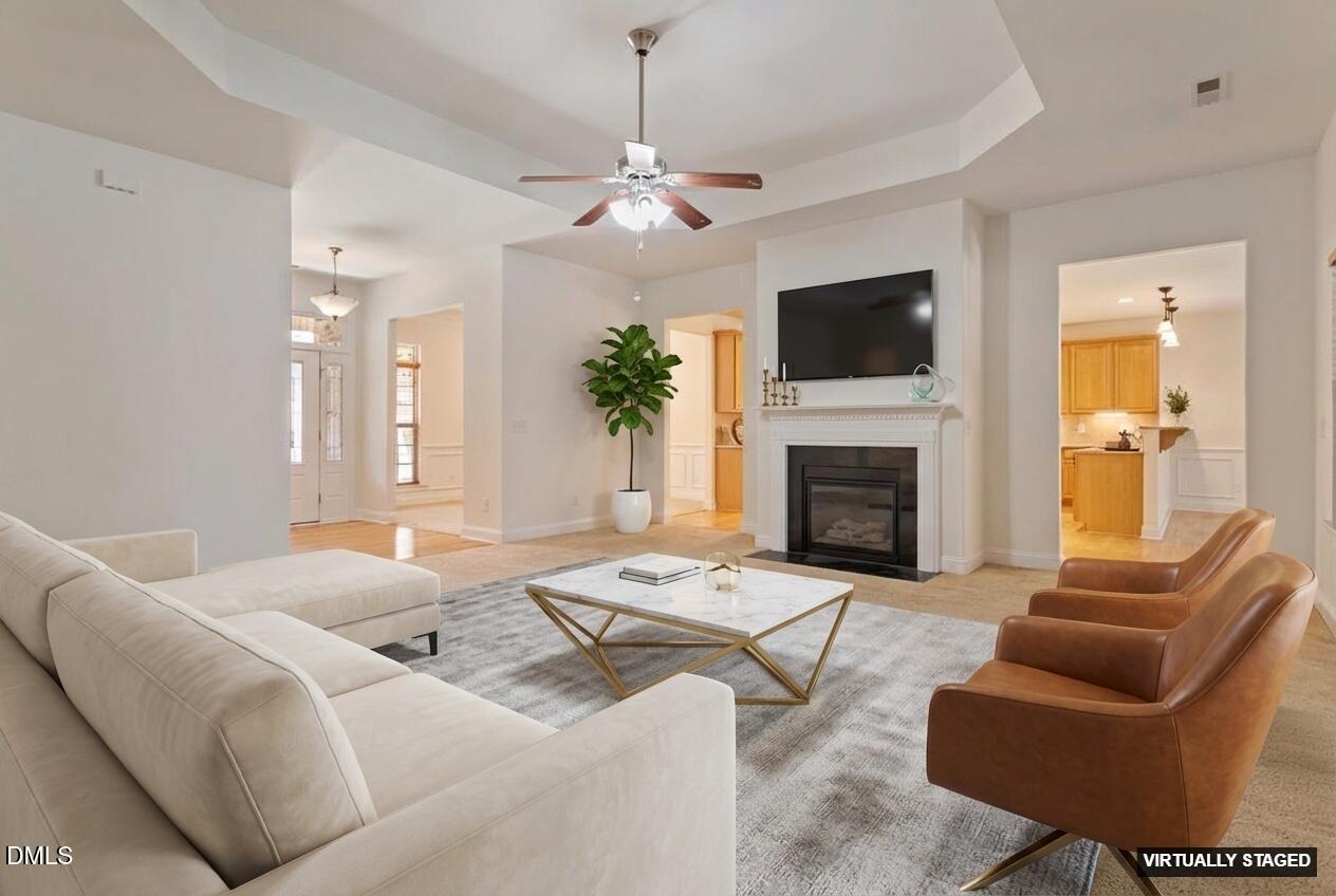 46 Spring Haven Lane Willow Spring, NC 27592 - Photo 13 of 50 a living room with furniture a flat screen tv and a fireplace