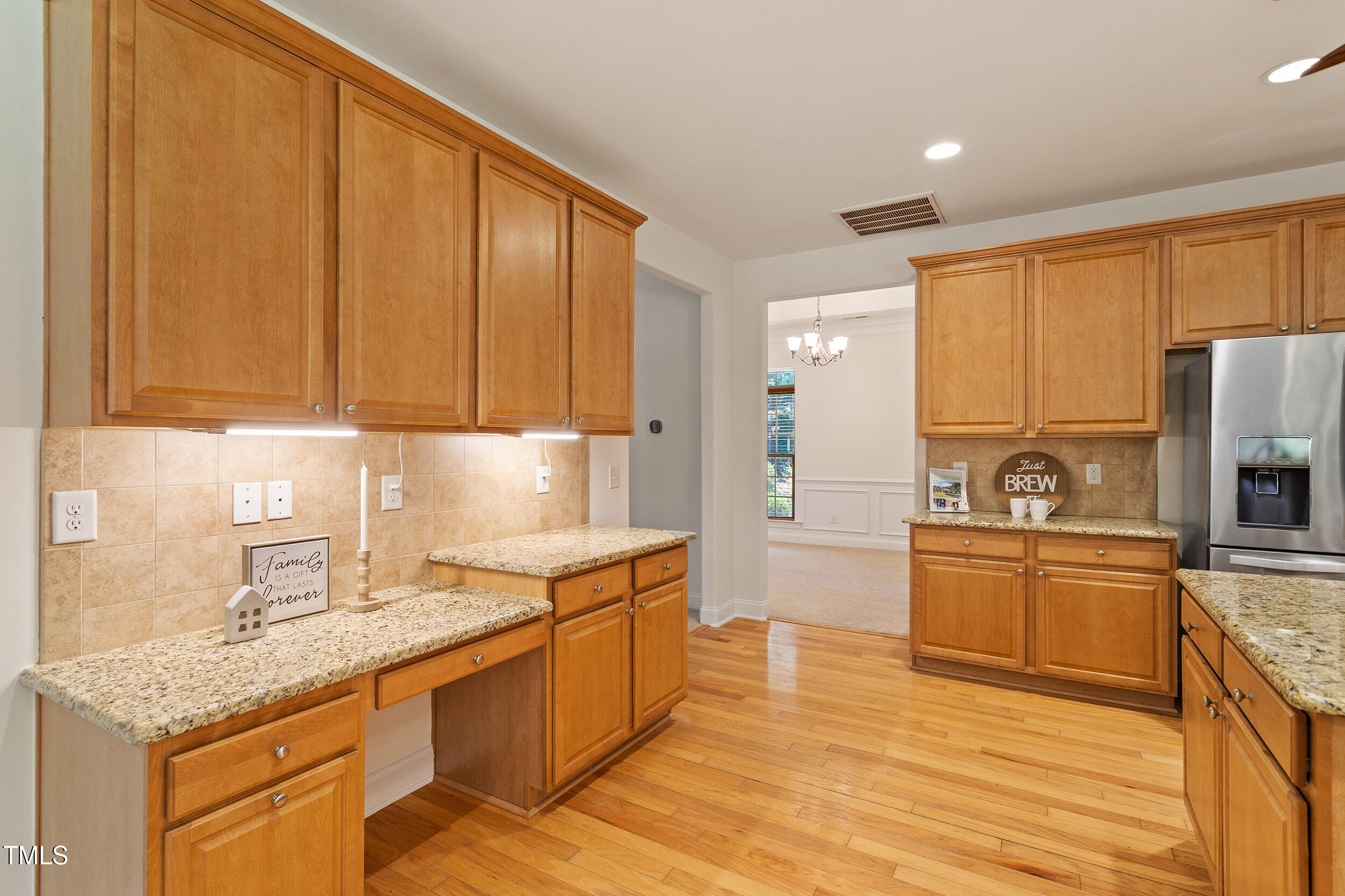 46 Spring Haven Lane Willow Spring, NC 27592 - Photo 21 of 50 a kitchen with stainless steel appliances granite countertop a sink stove and refrigerator