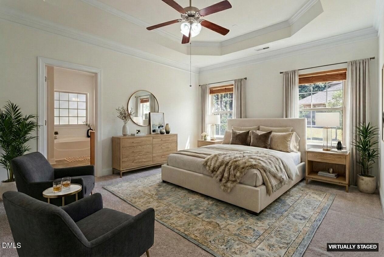 46 Spring Haven Lane Willow Spring, NC 27592 - Photo 30 of 50 a spacious bedroom with a bed a couch and a window