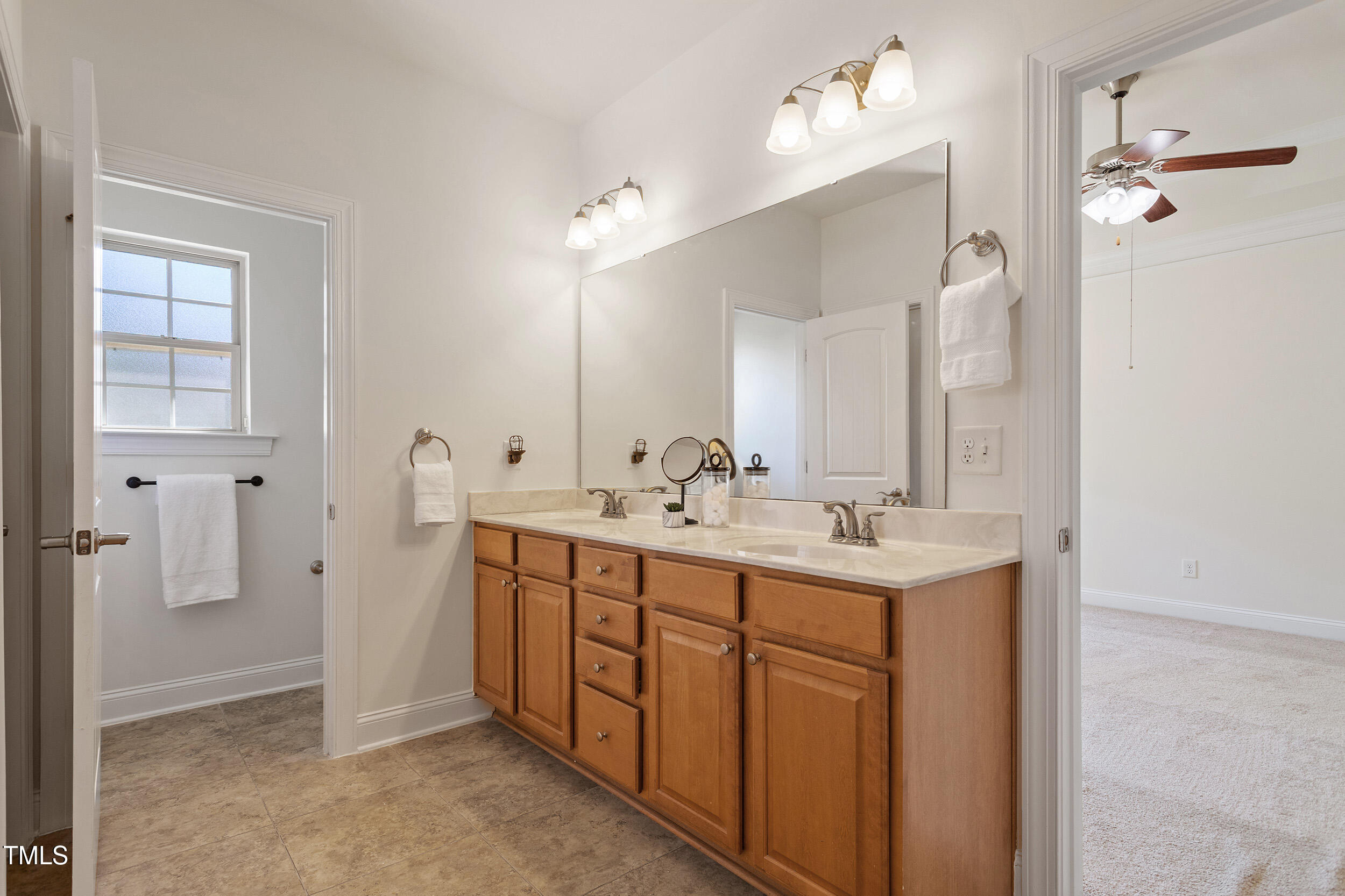 46 Spring Haven Lane Willow Spring, NC 27592 - Photo 32 of 50 a bathroom with double sink and mirror