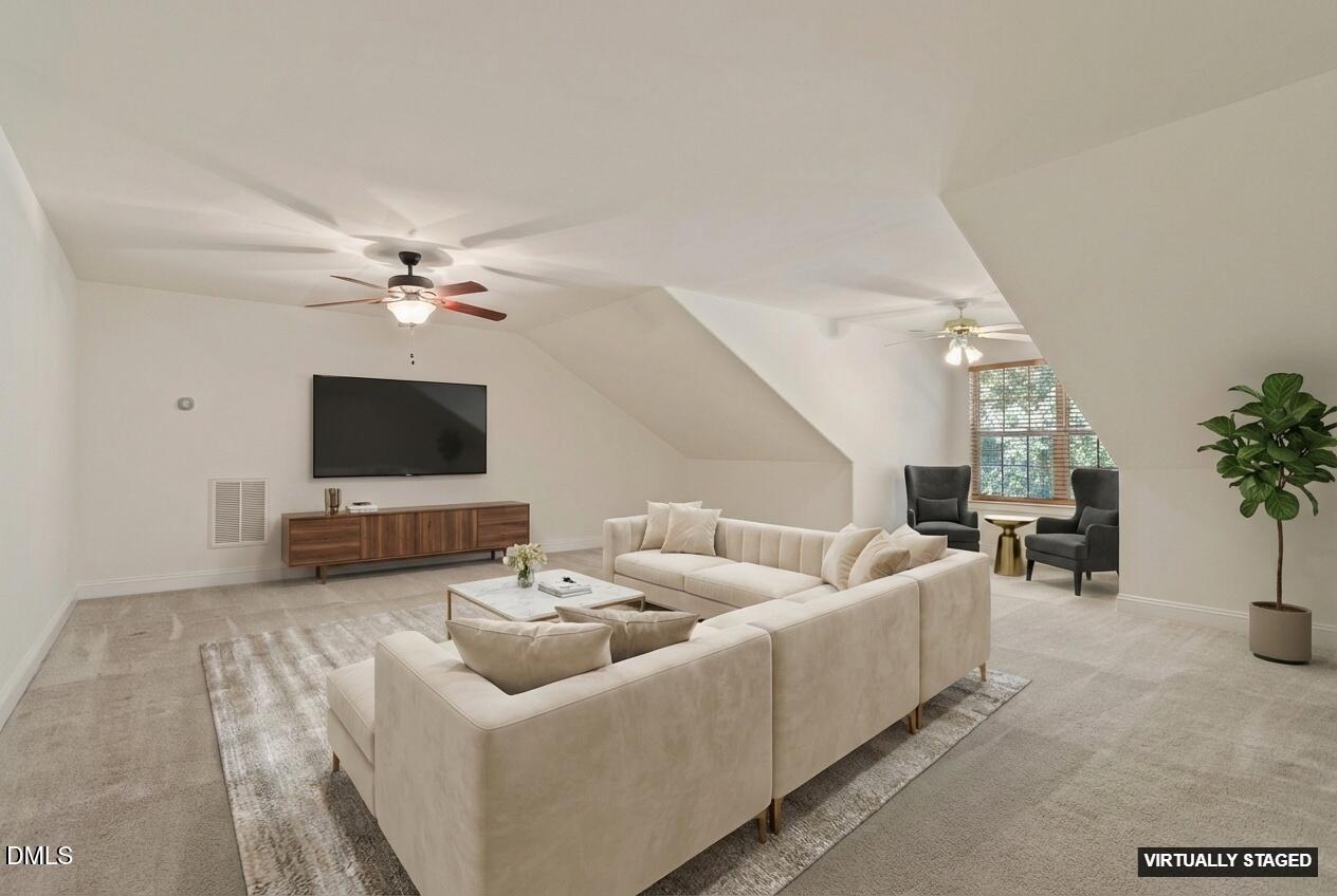 46 Spring Haven Lane Willow Spring, NC 27592 - Photo 38 of 50 a living room with furniture and a flat screen tv