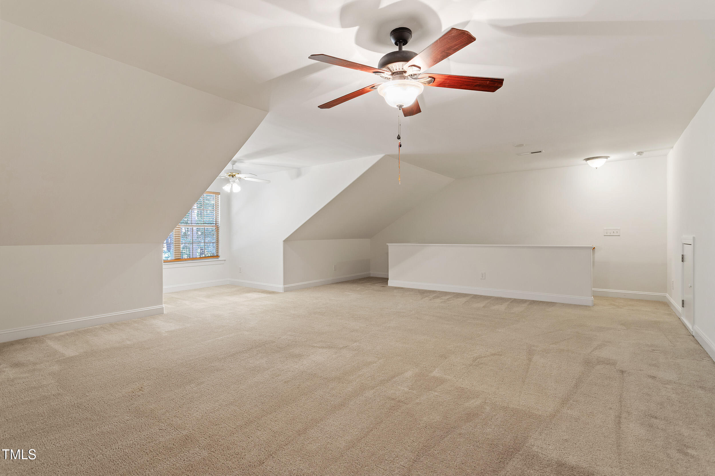 46 Spring Haven Lane Willow Spring, NC 27592 - Photo 40 of 50 an empty room with ceiling fan and window