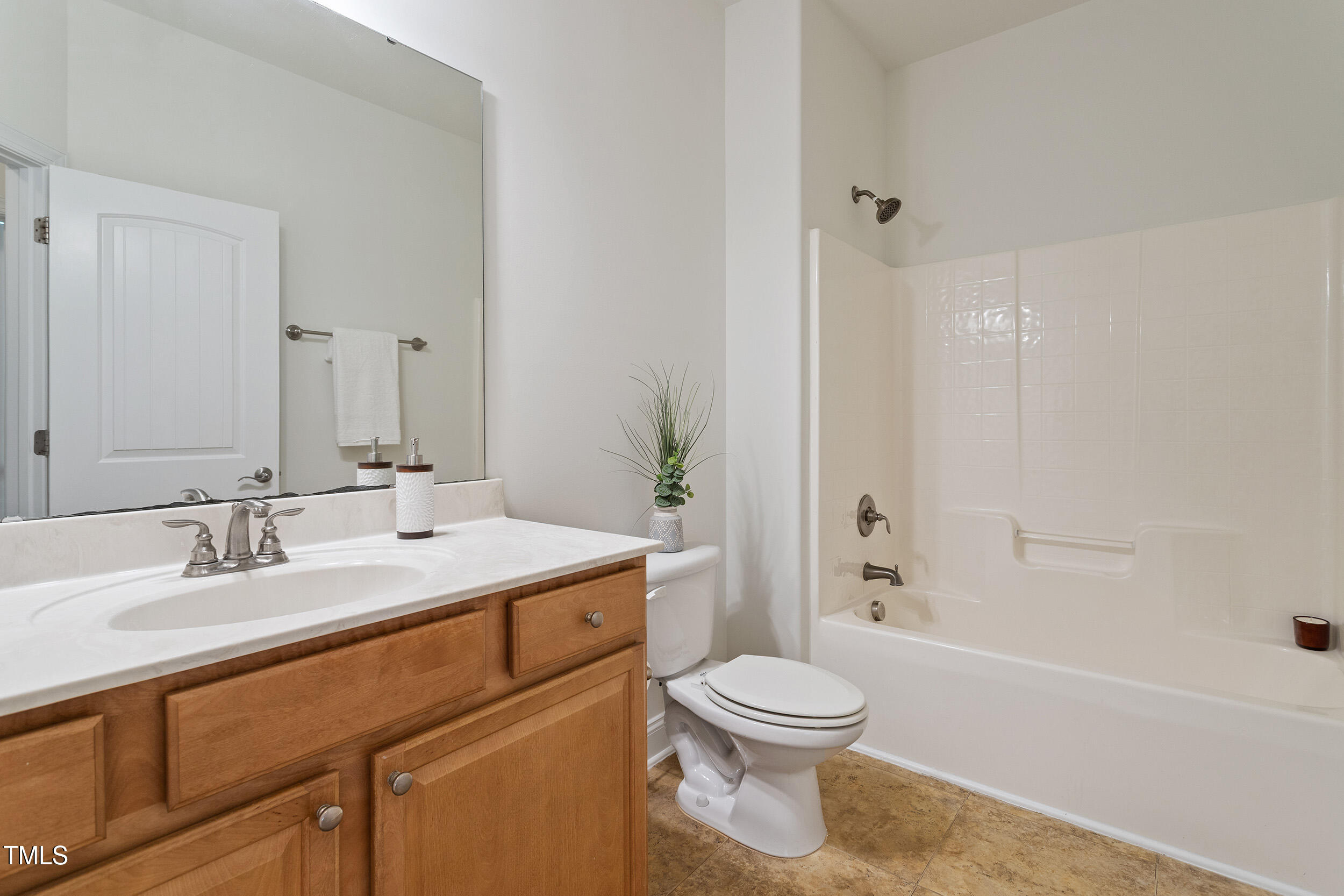 46 Spring Haven Lane Willow Spring, NC 27592 - Photo 41 of 50 a bathroom with a sink a toilet and shower