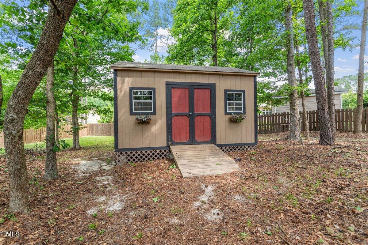 46 Spring Haven Lane Willow Spring, NC 27592 - Photo 46 of 50 a front view of a house with a garden