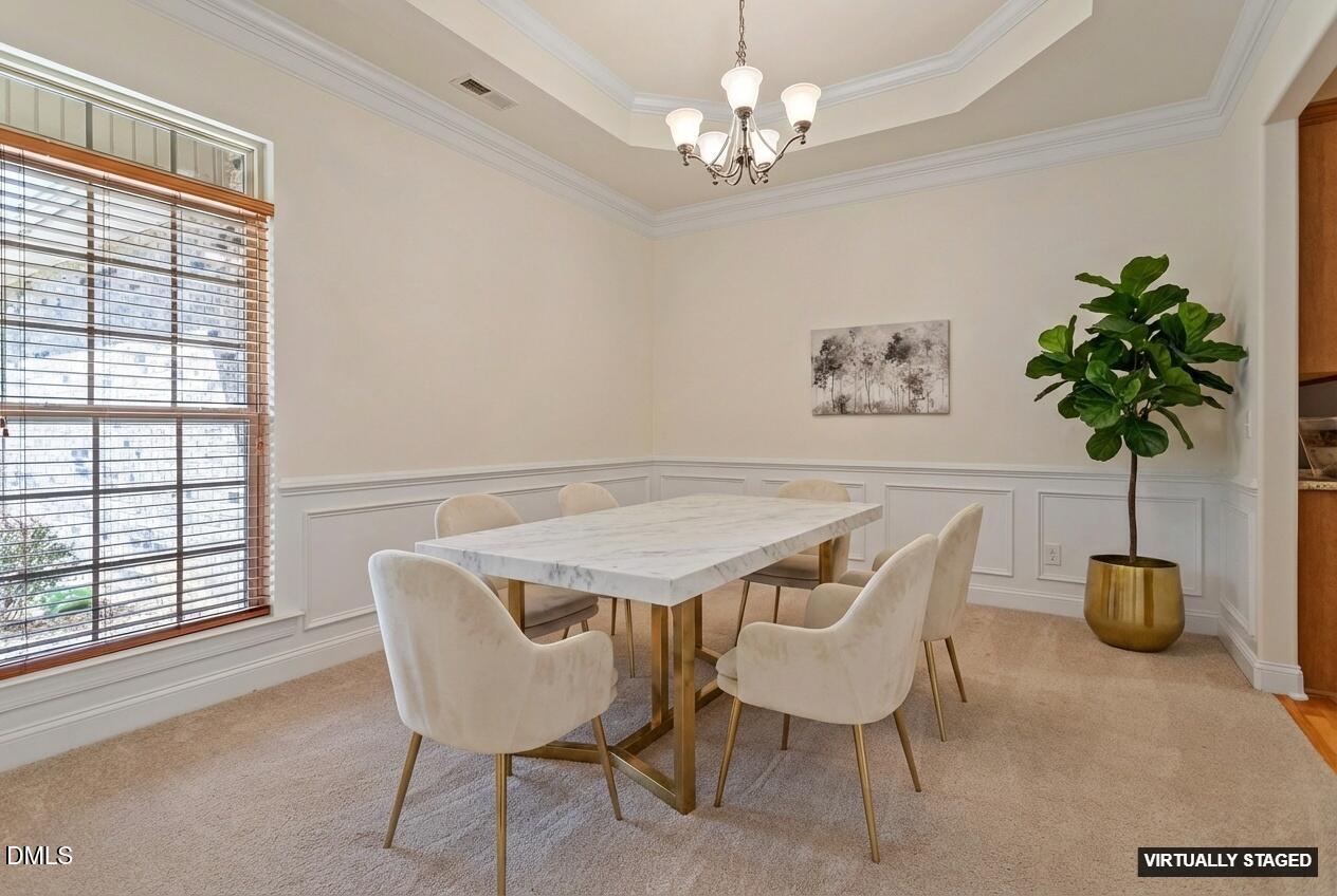46 Spring Haven Lane Willow Spring, NC 27592 - Photo 6 of 50 a view of a dining room with furniture and a chandelier