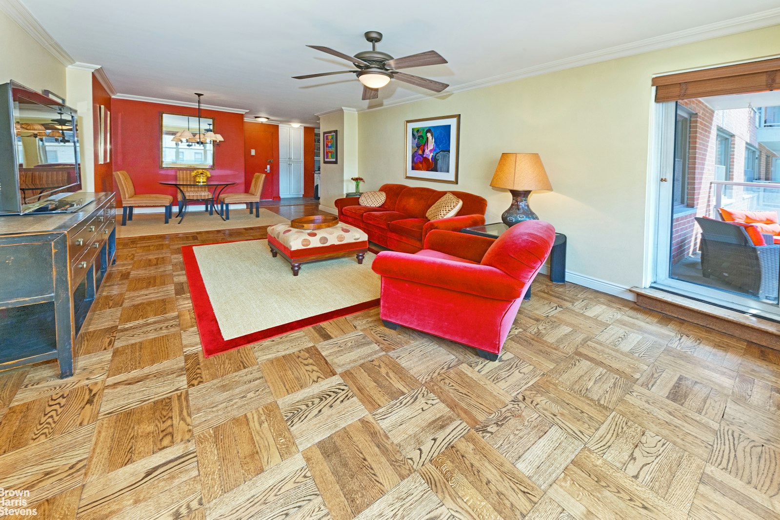 300 East 71st Street, Unit 6M Manhattan, NY 10021 - Photo 2 of 8 a living room with patio furniture and a flat screen tv