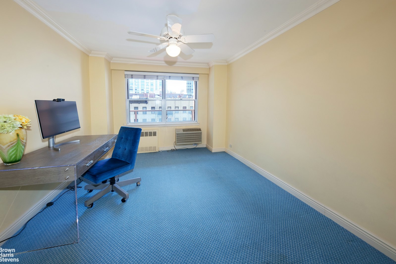 300 East 71st Street, Unit 6M Manhattan, NY 10021 - Photo 7 of 8 a view of a workspace with furniture and a window