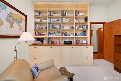 a bedroom with a bed and a bookshelf