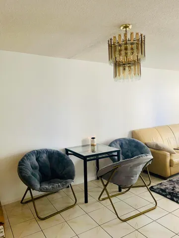 a living room with a couch and a bookshelf
