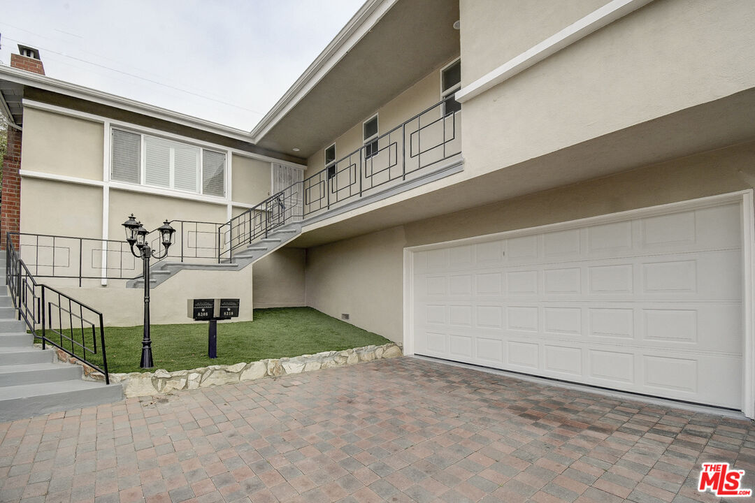 a view of a house with a garage