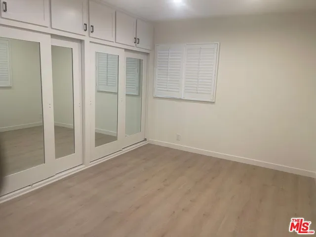 a bathroom with a shower and a sink