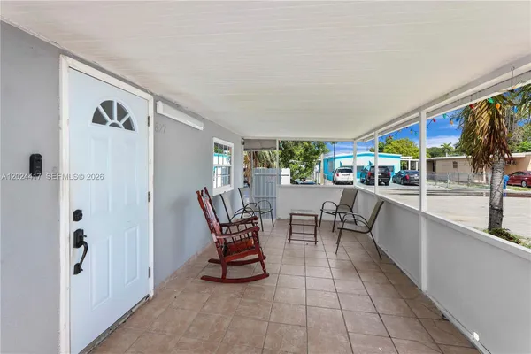 a view of a dining room with furniture window and outside view