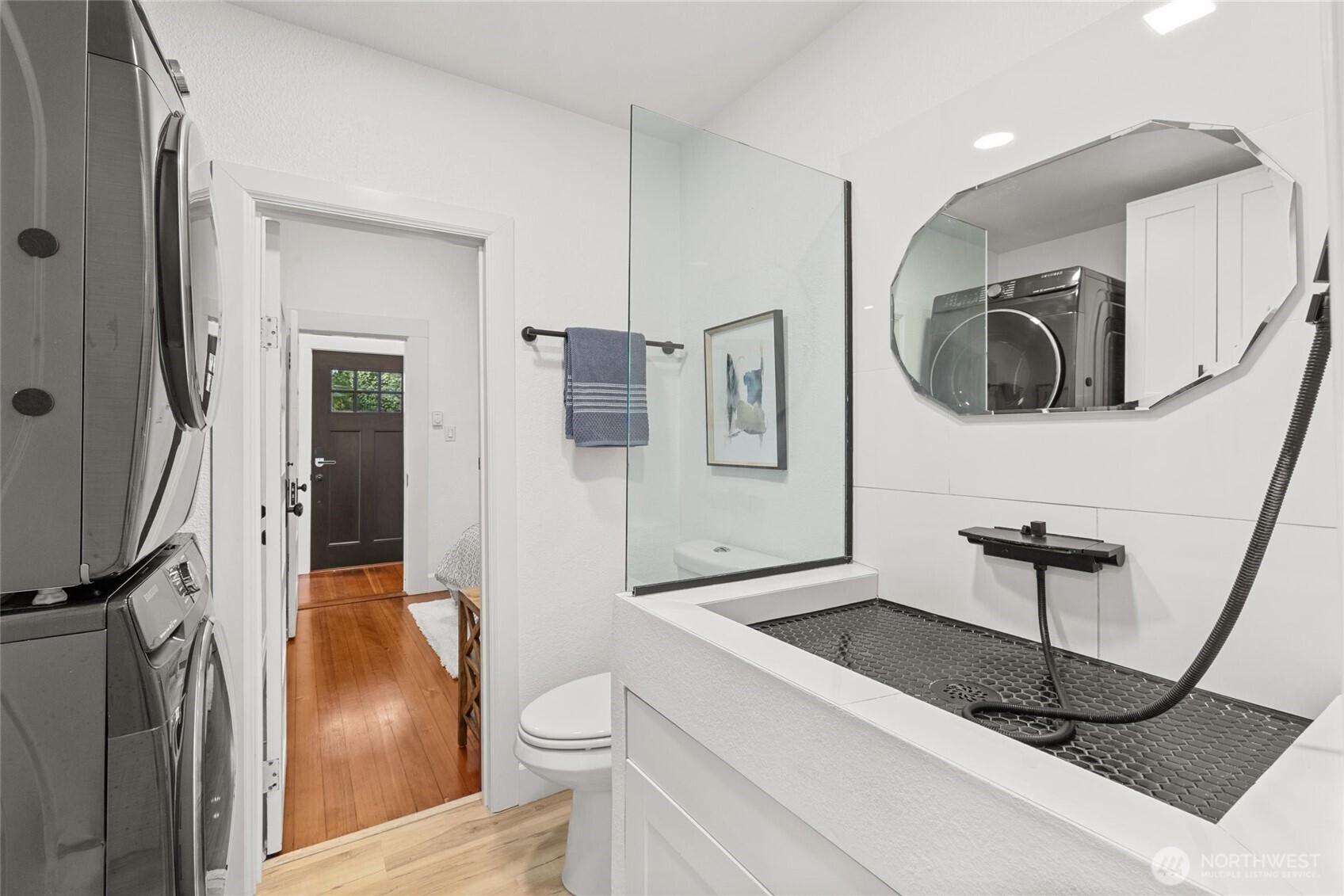 424 27th Avenue East Seattle, WA 98112 - Photo 12 of 36 a bathroom with a toilet a sink and a shower