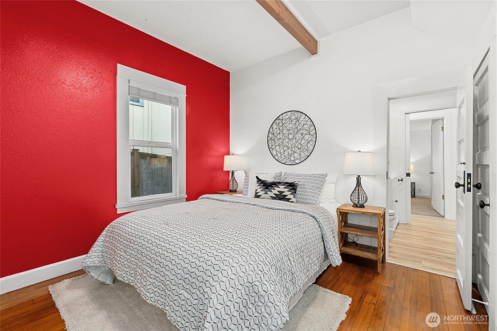 424 27th Avenue East Seattle, WA 98112 - Photo 13 of 36 a bedroom with a bed and a chandelier