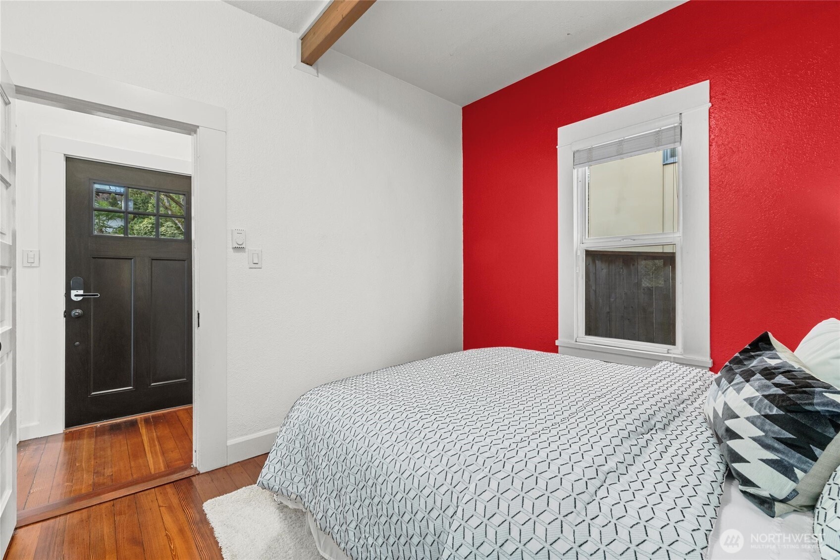424 27th Avenue East Seattle, WA 98112 - Photo 14 of 36 a bedroom with a bed and a mirror