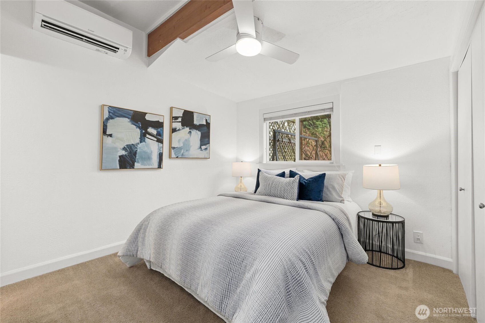 424 27th Avenue East Seattle, WA 98112 - Photo 15 of 36 a bedroom with a bed and window