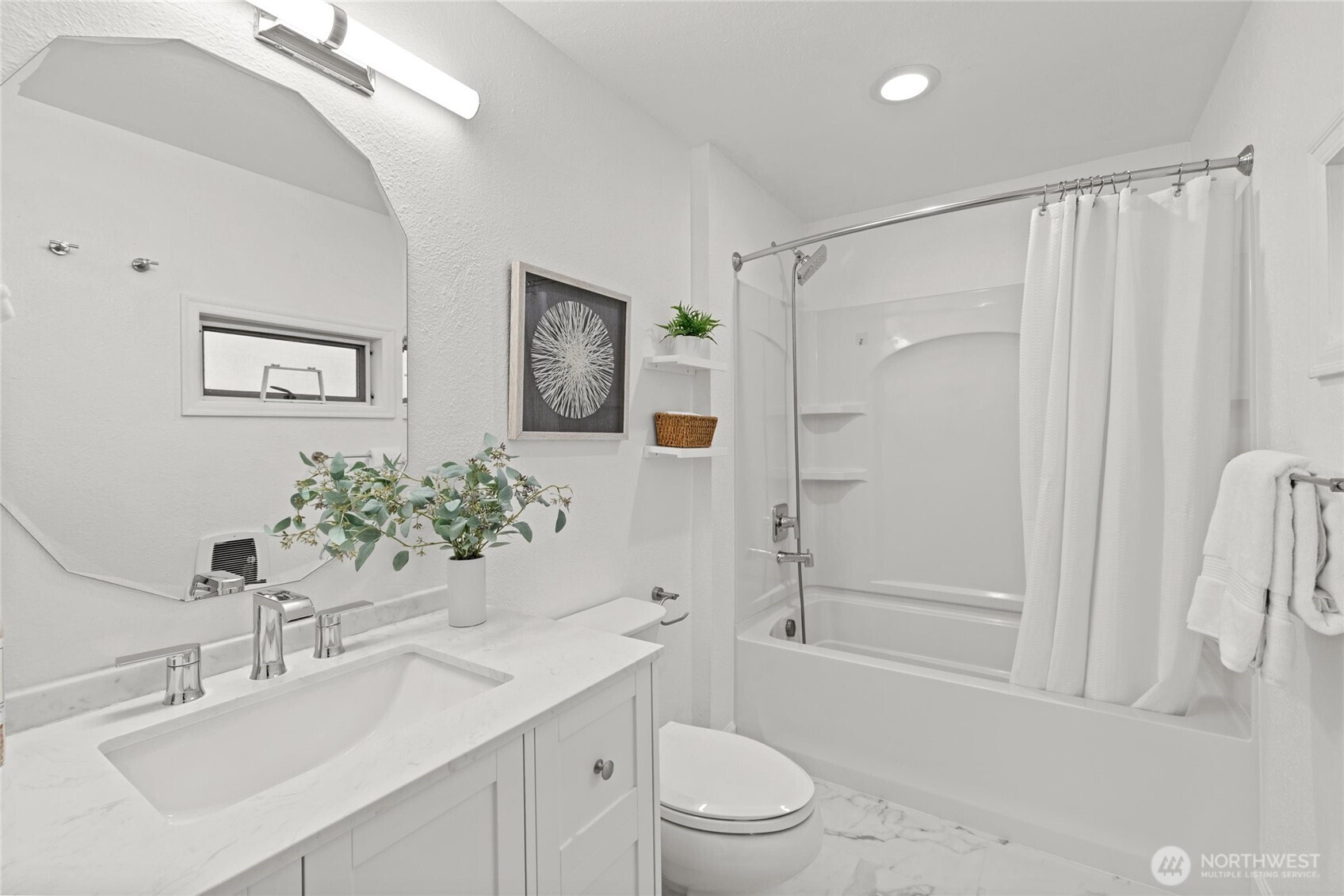 424 27th Avenue East Seattle, WA 98112 - Photo 16 of 36 a bathroom with a sink a toilet and shower