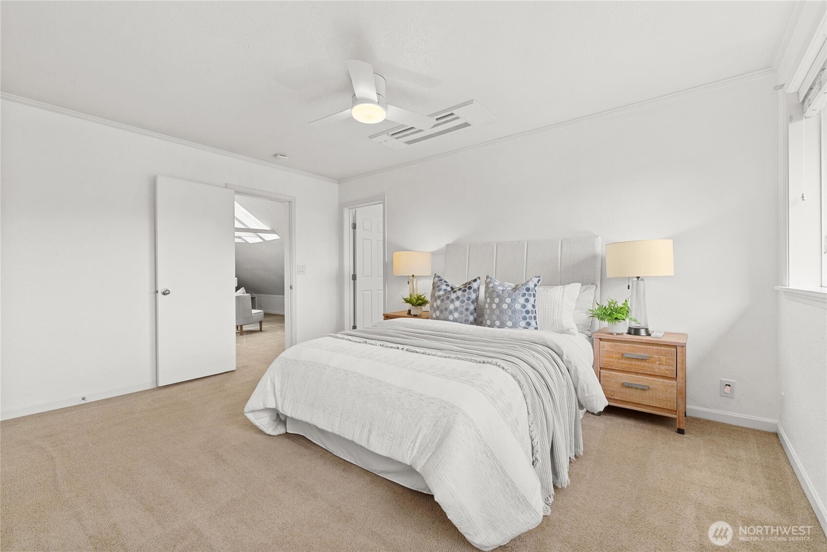 424 27th Avenue East Seattle, WA 98112 - Photo 19 of 36 a bedroom with a bed and a window