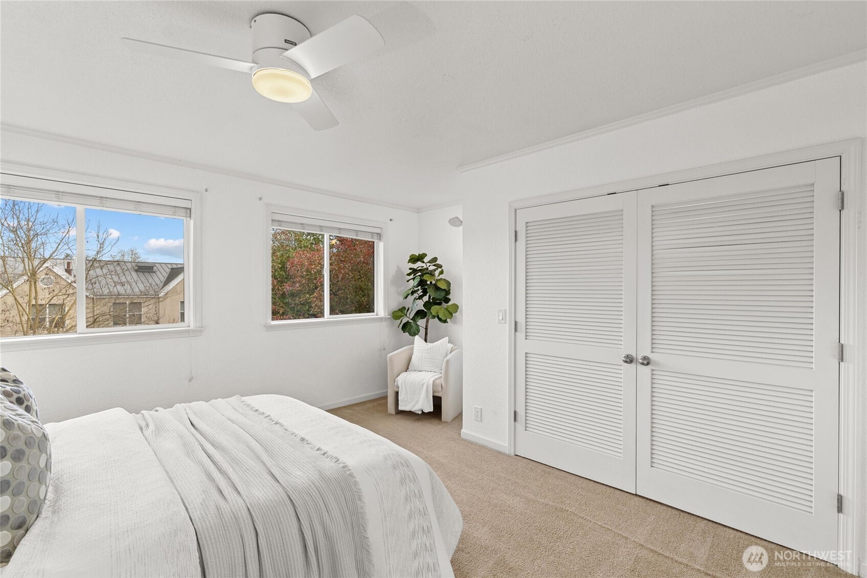 424 27th Avenue East Seattle, WA 98112 - Photo 20 of 36 a bedroom with a bed and a window