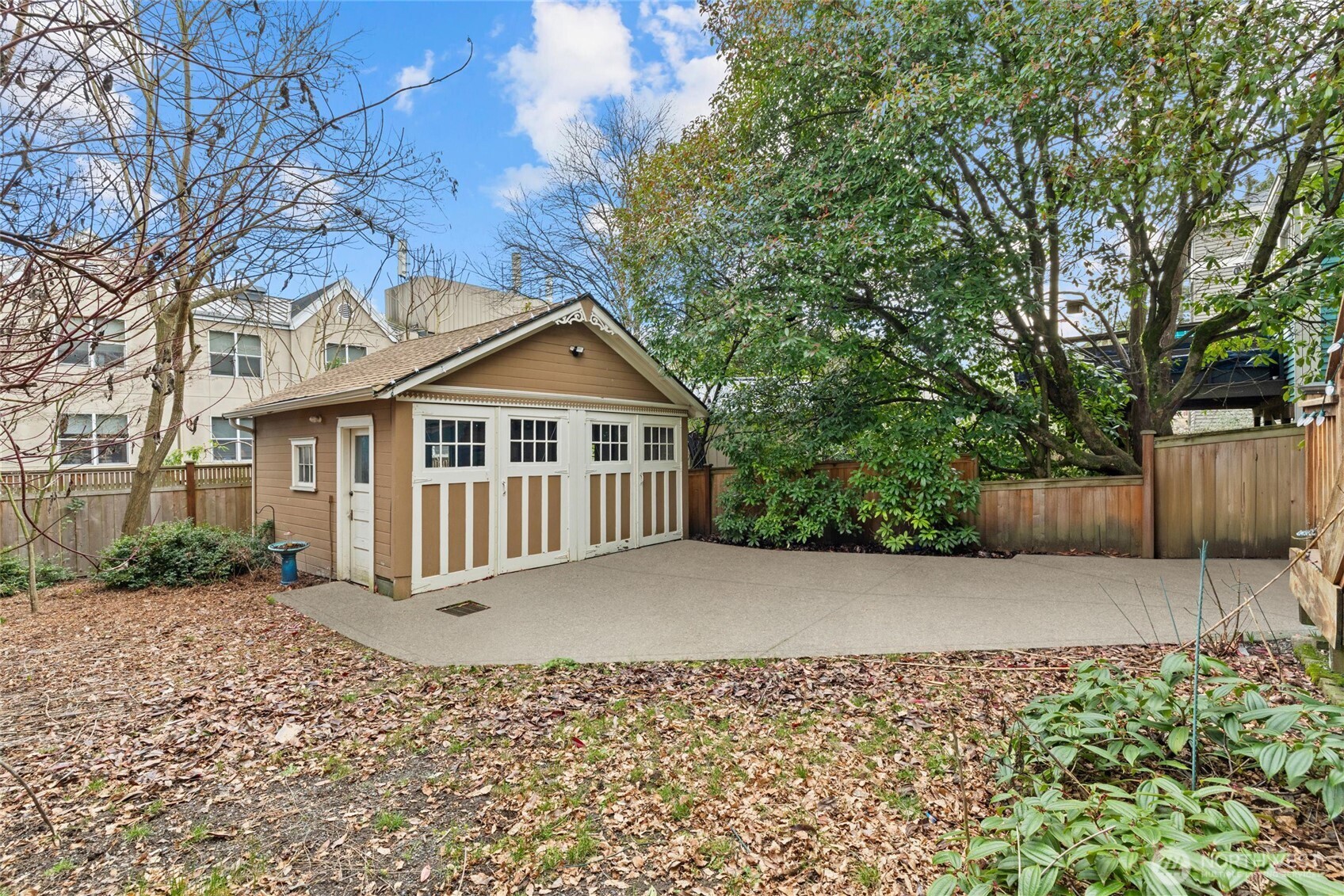 424 27th Avenue East Seattle, WA 98112 - Photo 24 of 36 a front view of a house with a garden