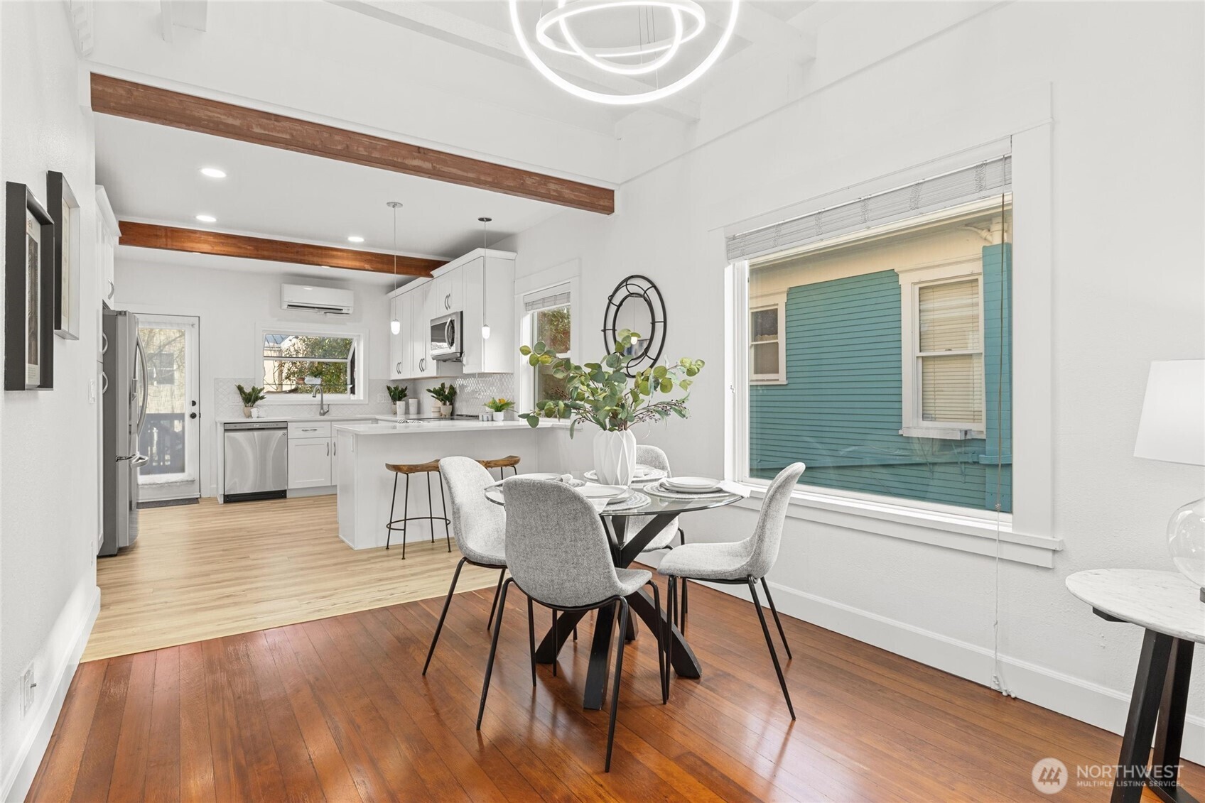 424 27th Avenue East Seattle, WA 98112 - Photo 8 of 36 a view of a dining room with furniture and a large window