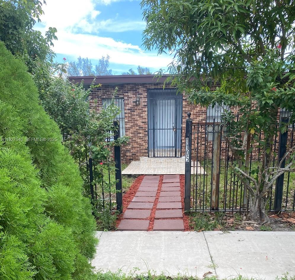a sign board with yard in the back