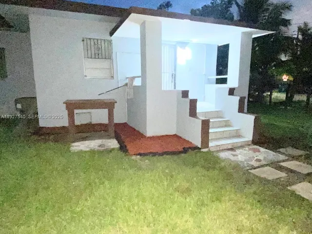 a house view with a garden space