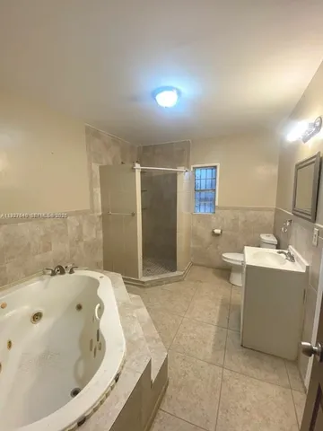 a bathroom with a bathtub and a sink