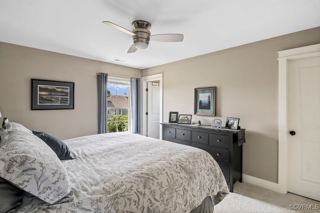 16413 Lambourne Road Midlothian, VA 23112 - Photo 14 of 33 a bedroom with a large bed and a tv