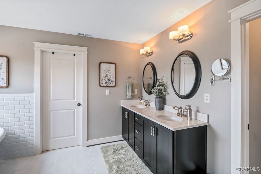 16413 Lambourne Road Midlothian, VA 23112 - Photo 18 of 33 a bathroom with a double vanity sink and a mirror
