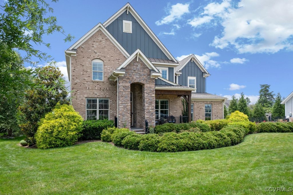 16413 Lambourne Road Midlothian, VA 23112 - Photo 2 of 33 a front view of a house with a yard
