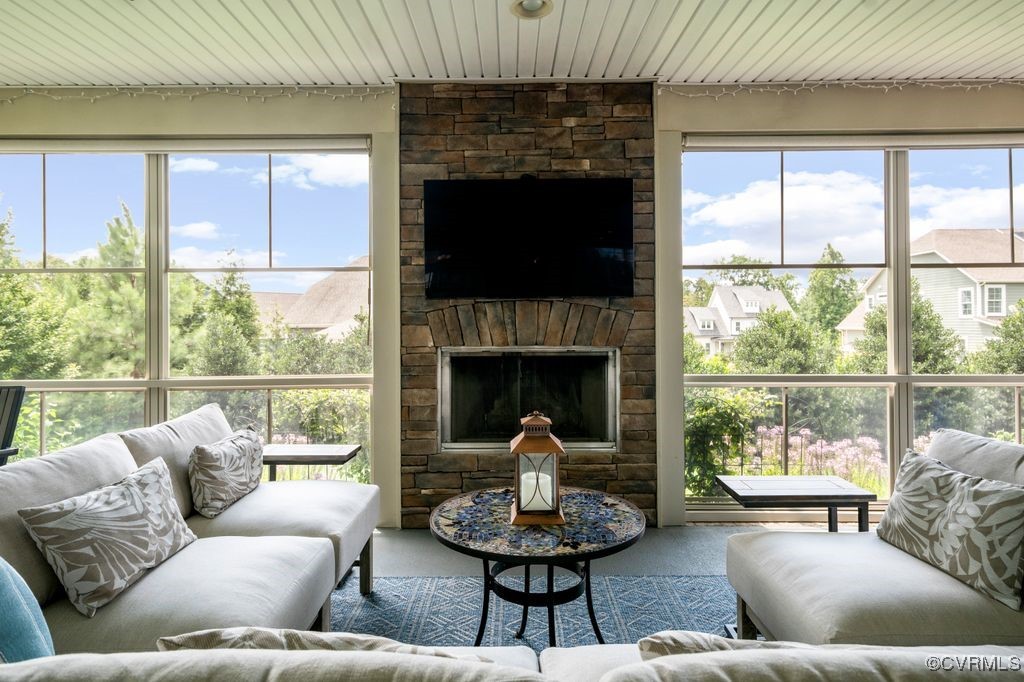 16413 Lambourne Road Midlothian, VA 23112 - Photo 22 of 33 a living room with furniture a fireplace and a large window