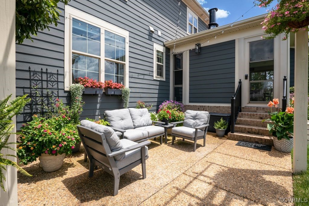 16413 Lambourne Road Midlothian, VA 23112 - Photo 24 of 33 a view of a patio with couches and a potted plant