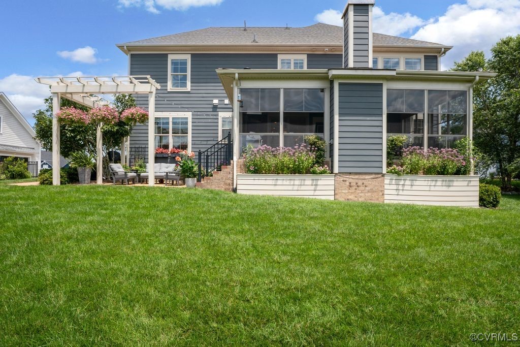 16413 Lambourne Road Midlothian, VA 23112 - Photo 26 of 33 a view of a house with a yard and sitting area