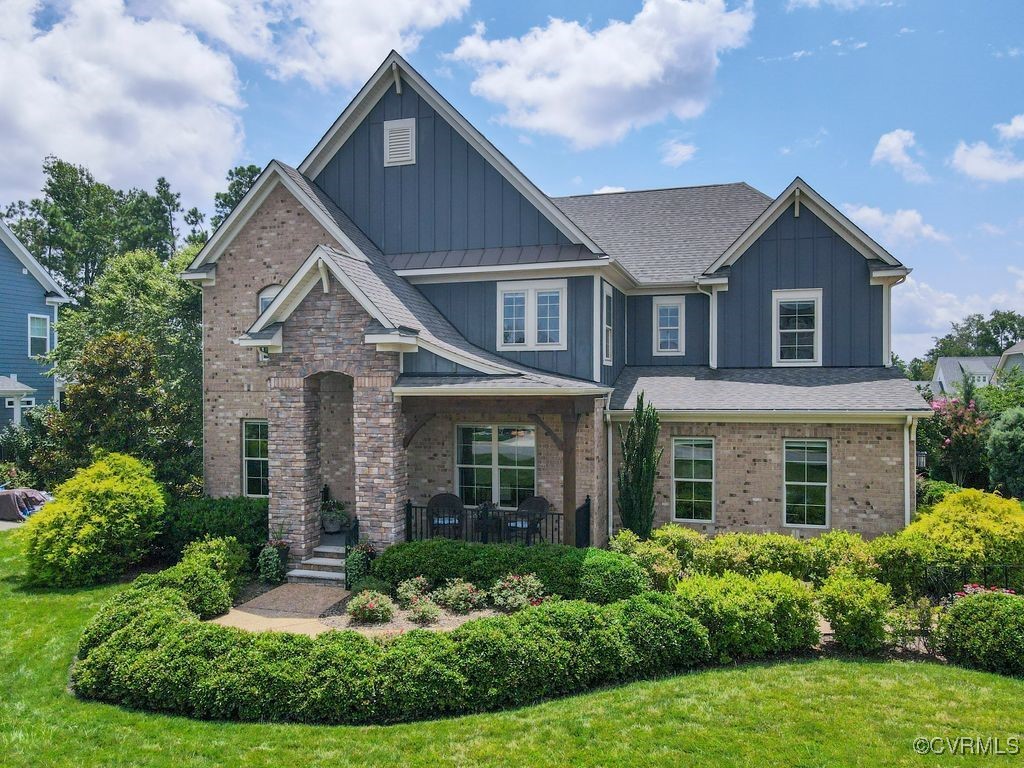 16413 Lambourne Road Midlothian, VA 23112 - Photo 3 of 33 front view of brick house with a yard