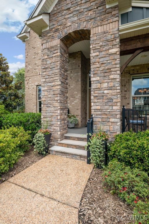 16413 Lambourne Road Midlothian, VA 23112 - Photo 4 of 33 a front view of a house with a yard