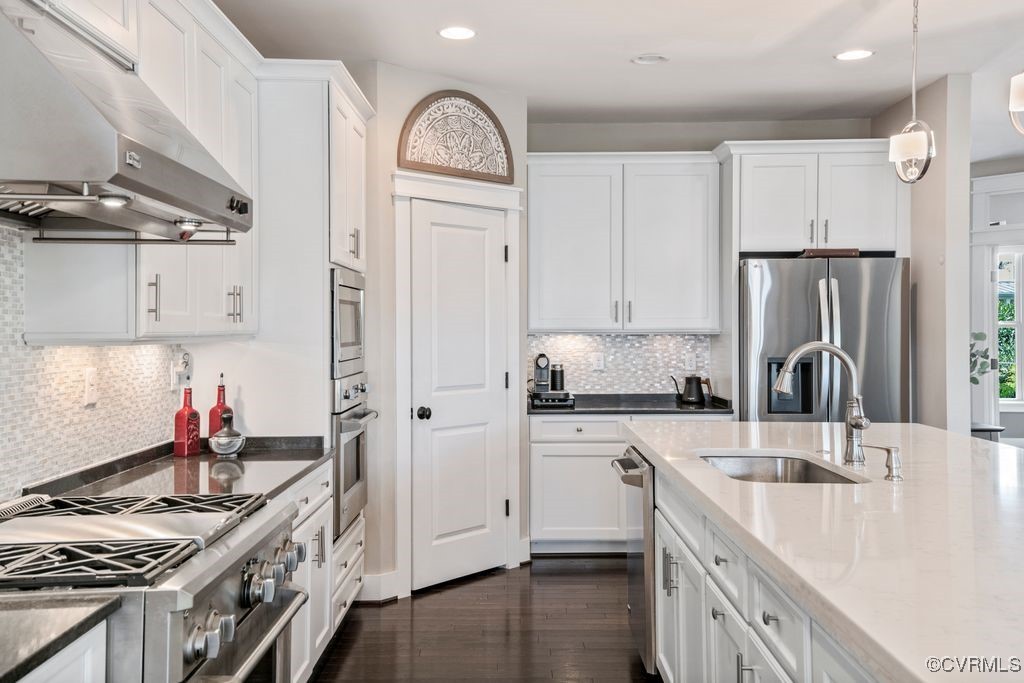 16413 Lambourne Road Midlothian, VA 23112 - Photo 9 of 33 a kitchen with stainless steel appliances granite countertop a sink stove and refrigerator