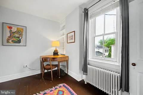 a workspace with furniture and window