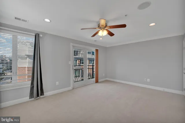 a view of a room with cabinet and a window