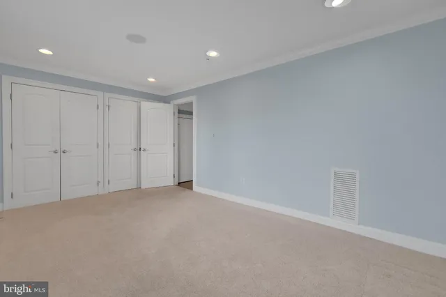 a picture of a bench in front of a wall