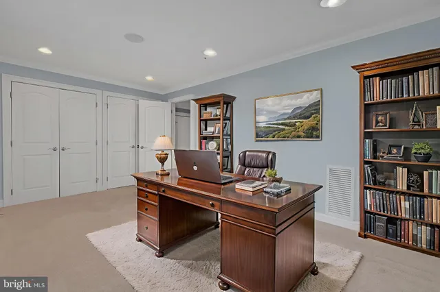 a picture of a bench in front of a wall