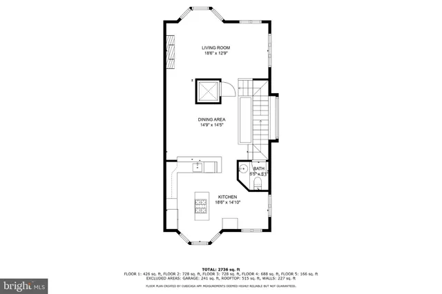 a black white and white photo of a living room