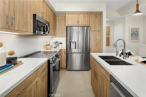 a kitchen with a sink stove and refrigerator