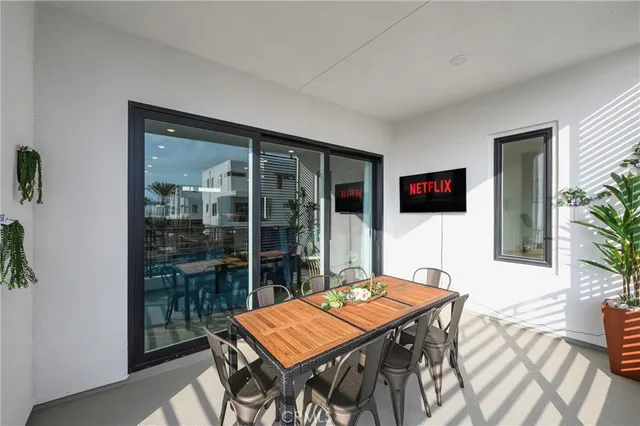 a view of a hallway with closet and utility room