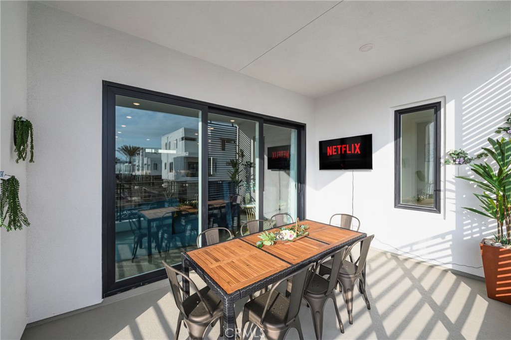 2053 Peebler Way Tustin, CA 92782 - Photo 19 of 37 a dining room with a table and chairs